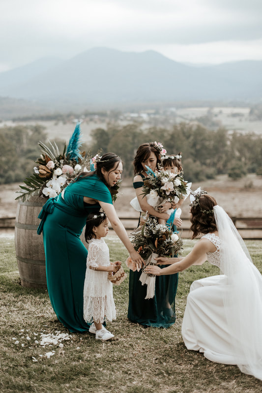 Bridal party at Riverstone Estate in the Yarra Valley holding boho flower bouquets. 